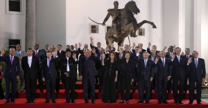 Regional leaders stand under a statue of Simon Bolívar during the CELAC summit in Havana