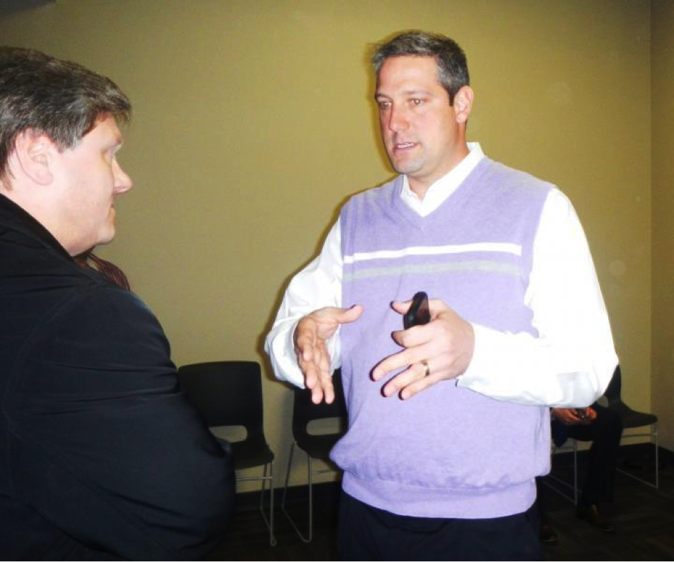 Congressman Tim Ryan is pictured here talking to a constituent. In an interview with BPR, Ryan said that he enjoys the ability of social media to “meet the people where they’re at” via Twitter and Facebook, platforms that simulate the humanistic characteristic of face-to-face interactions like these. 