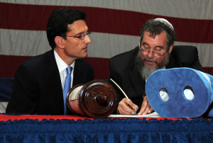 Eric Cantor with a rabbi and a Torah. 