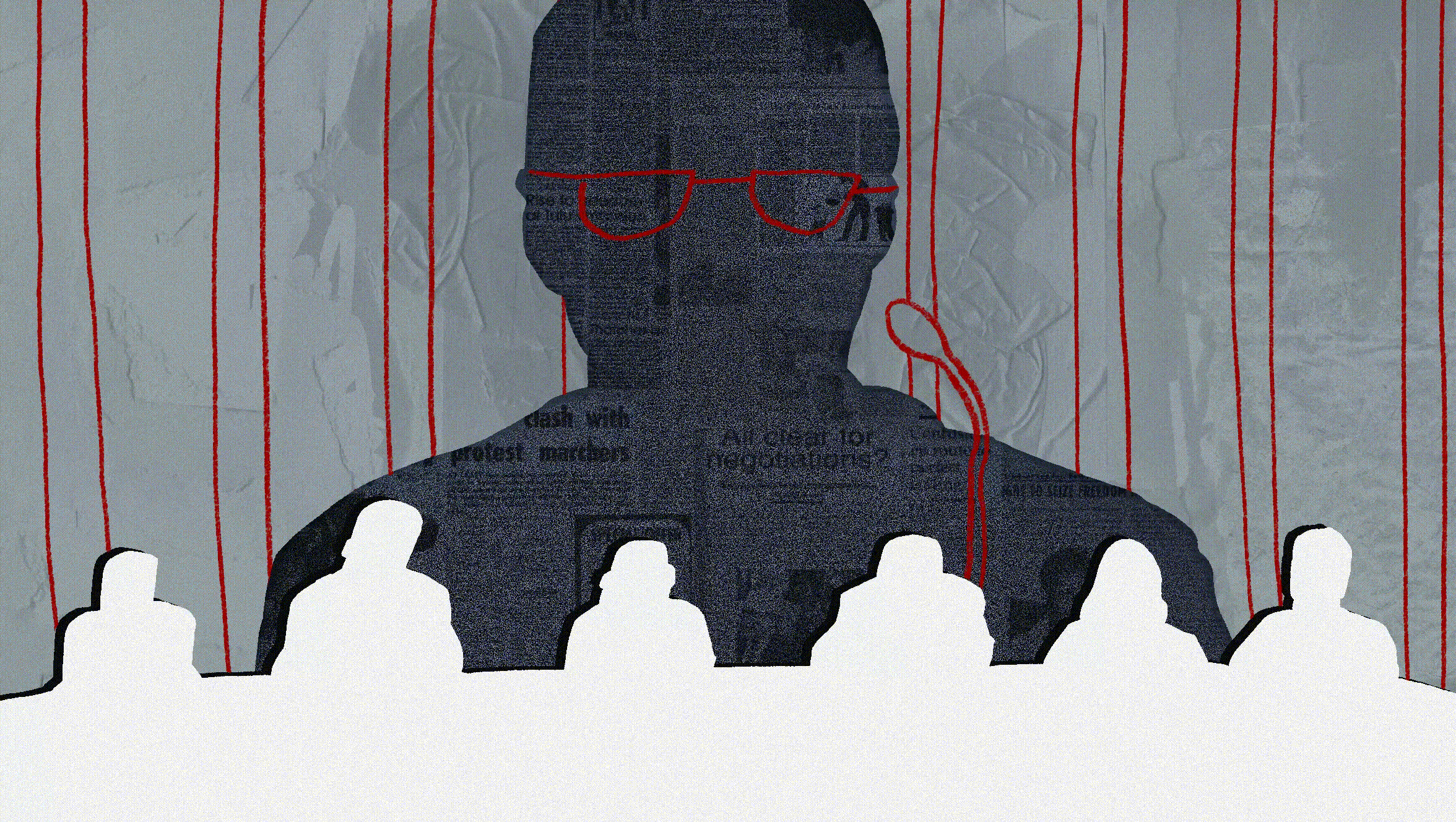 Man with red glasses speaking at a podium